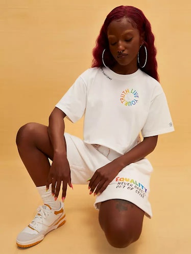 a woman wears sweatshorts from Levi's, a brand supporting LGBTQ+ communities