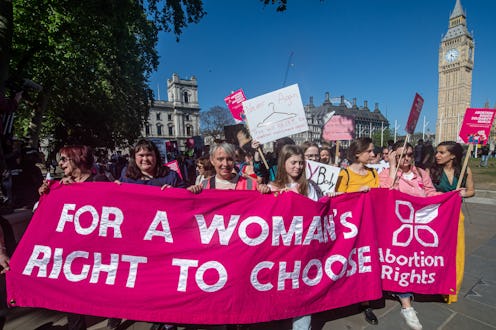 Women march in London against the U.S. Supreme Court's decision to overturn Roe v. Wade