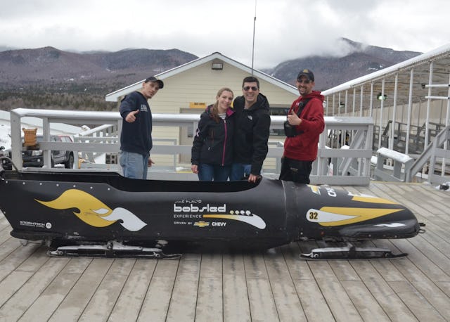 A married couple during a bobsled adventure date