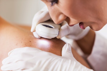 dermatologist examining skin