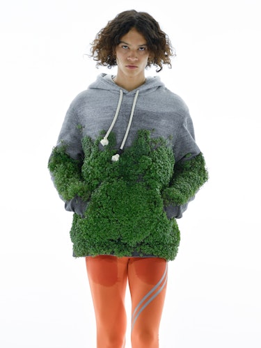 A model wearing a moss-covered sweatshirt on the Loewe spring 2023 menswear runway