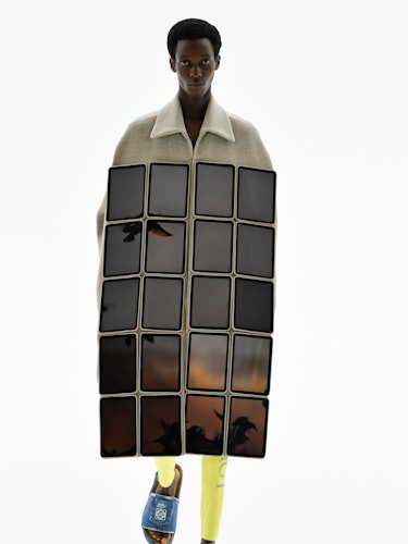 A model wearing a panel of Loewe screens