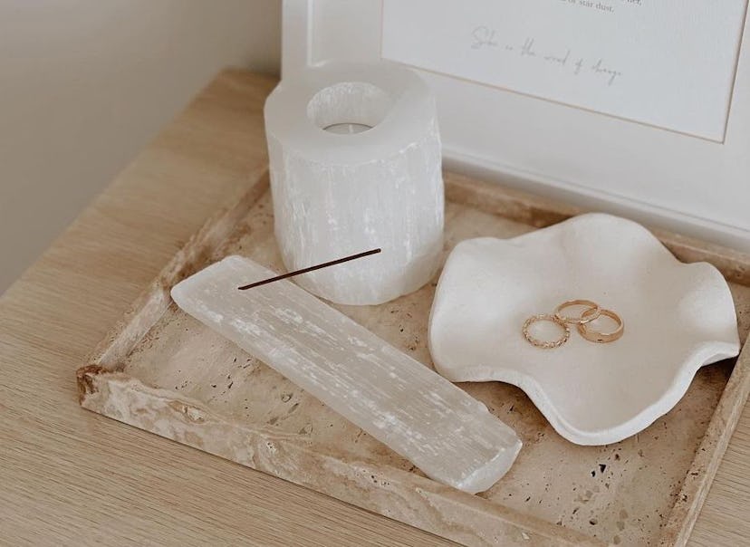 Trey with a selenite incense holder, selenite candle holder, and ceramic dish with gold rings. Clean...