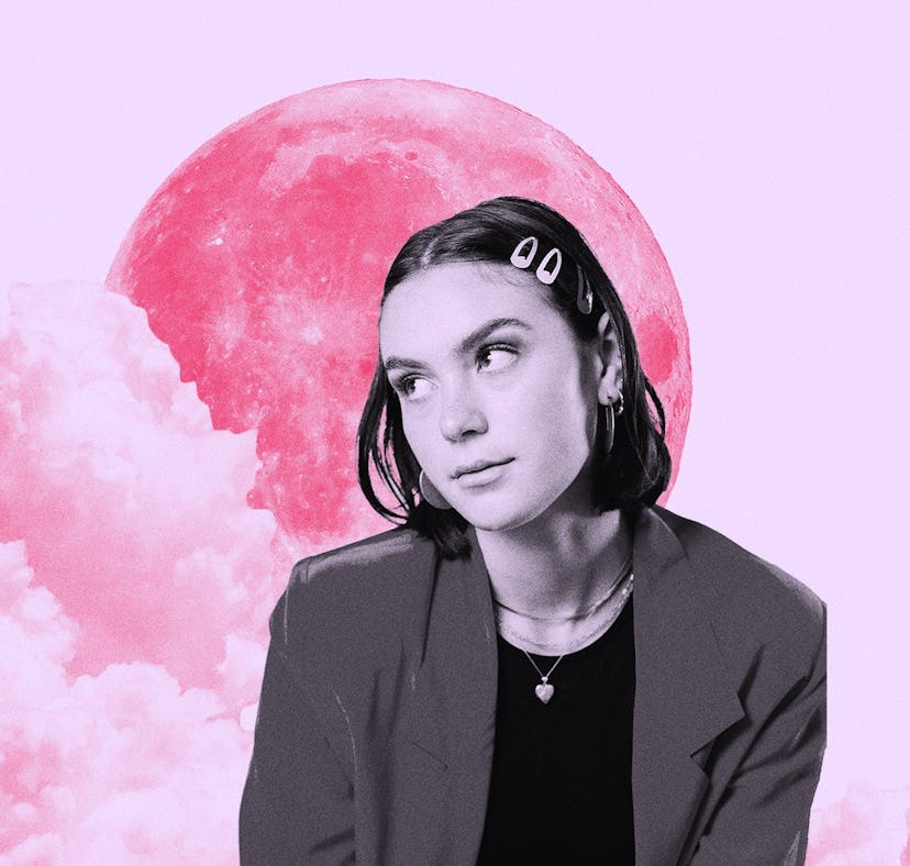 Young woman in front of the moon after reading her July 2022 monthly horoscope.