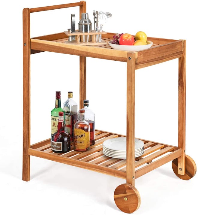 rolling wooden trolley cart with items atop it