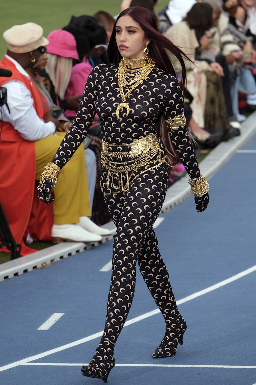 Lola Leon wearing a black Marine Serre cat suit