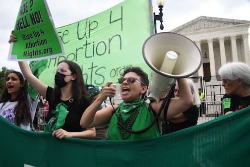 The meaning of green bandanas worn at protests.