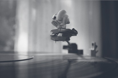 Marcel the Shell over a record player.