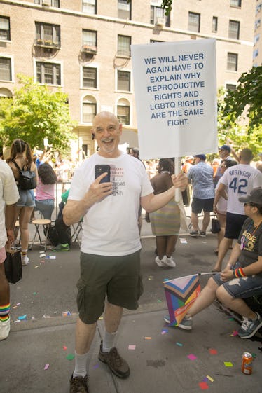 Scenes From NYC Pride Weekend 2022: A Celebration of Solidarity 11 A person carrying a sign about reproductive and LGBTQ rights at the 2022 NYC Pride March