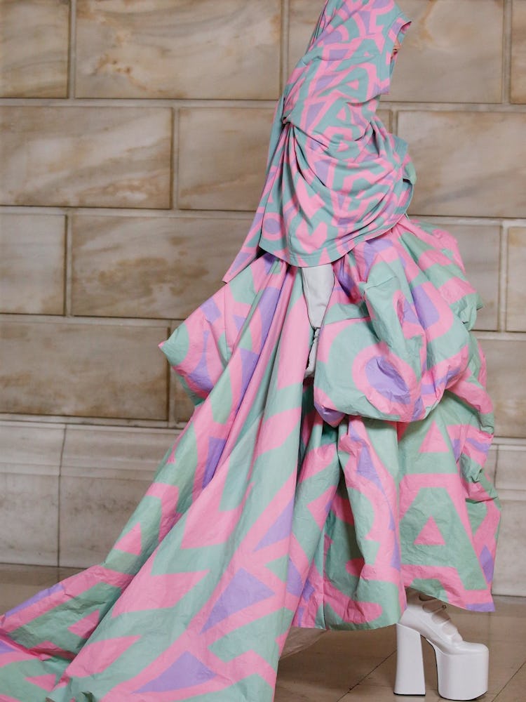 A model wearing a large draped Marc Jacobs design
