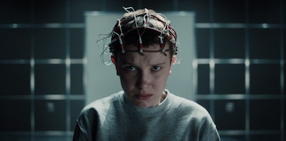 Millie Bobby wearing electrical connection on her head as "Eleven" character