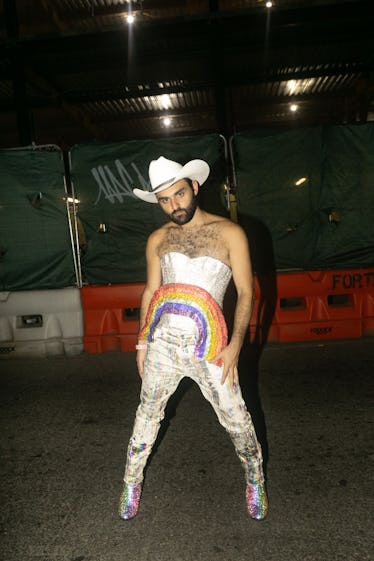 Scenes From NYC Pride Weekend 2022: A Celebration of Solidarity 15 A person wearing a white cowboy hat and rainbow at Ladyfag's 2022 Pride party