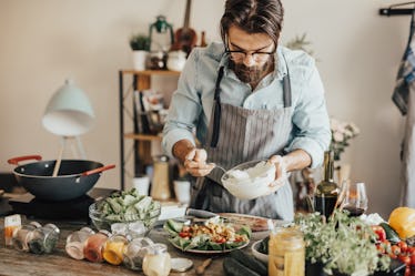 A man preparing a meal that fits into the Mediterranean diet.