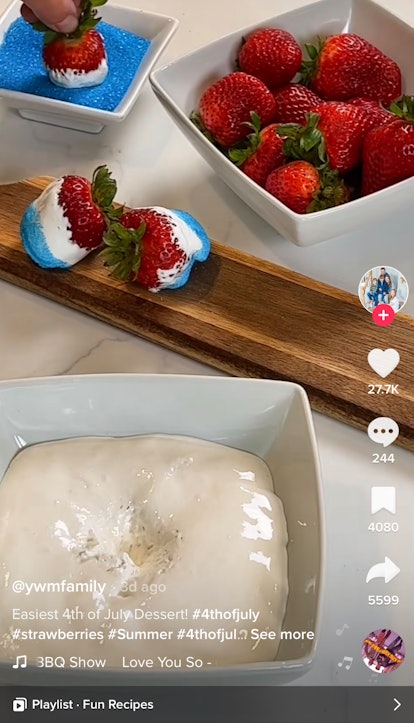 A woman shows off her Fourth of July recipes from TikTok of red, white, and blue strawberries. 