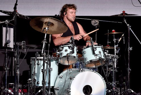 5 Seconds Of Summer drummer Ashton Irwin performing on stage in 2022
