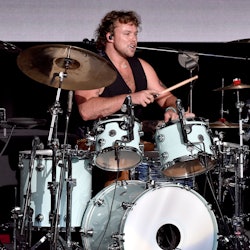 5 Seconds Of Summer drummer Ashton Irwin performing on stage in 2022