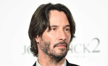 Full-profiled Keanu Reeves with his ultimate patchy beard