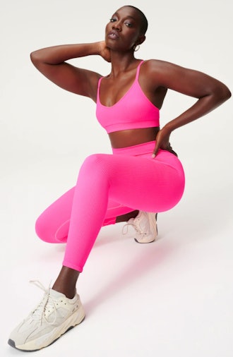 model wearing hot pink seamless chunky rib leggings