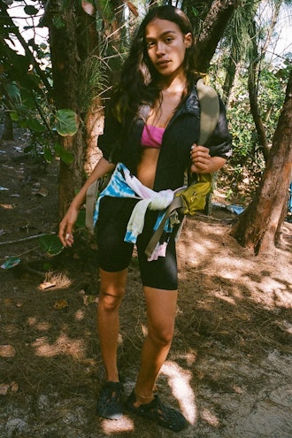 model wearing black high-waisted bike shorts from year of ours