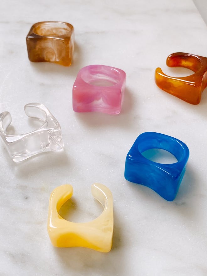 a variety of chunky resin rings from SJM studios