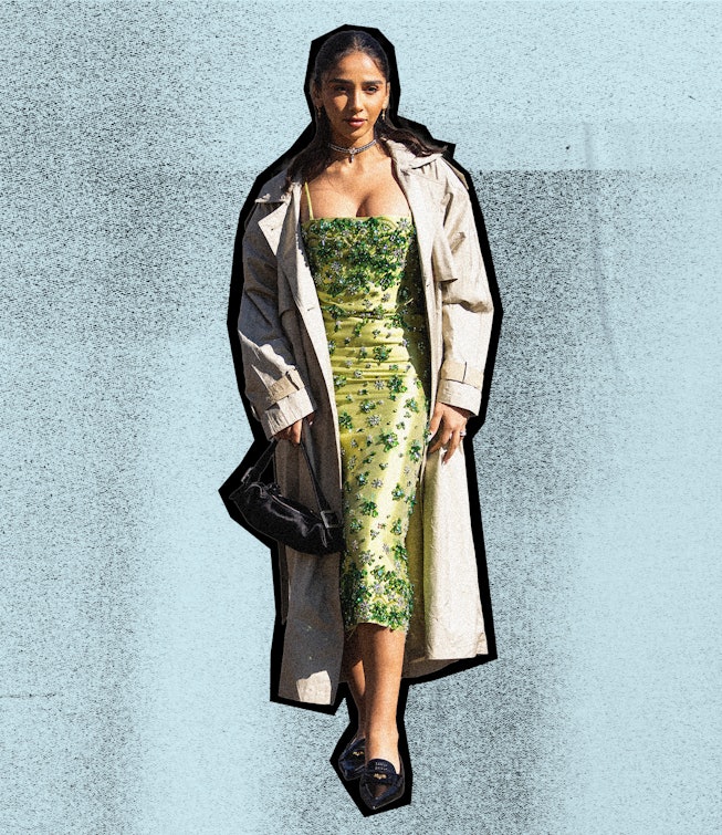 Female in a green vintage dress and white coat