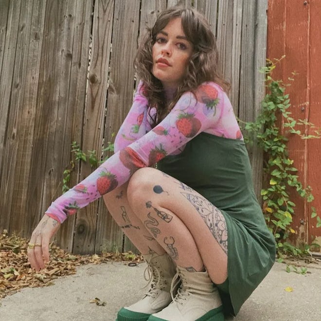 model crouching wearing the exercise dress from outdoor voices