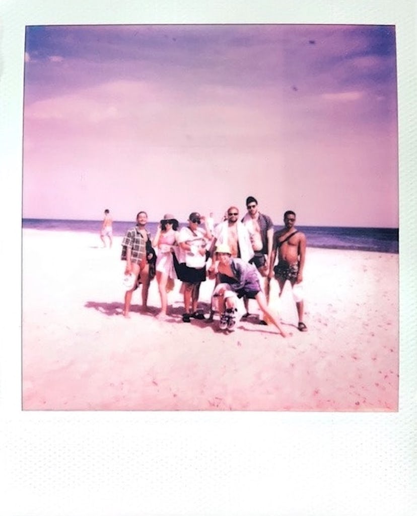 James Scully on a beach with his friends
