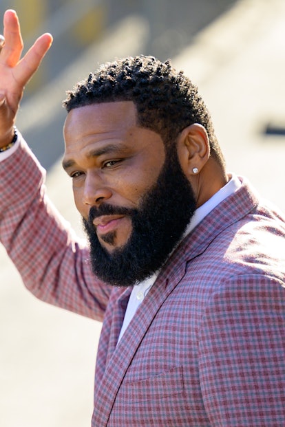 Anthony Anderson in a red blazer with a short haircut and big beard
