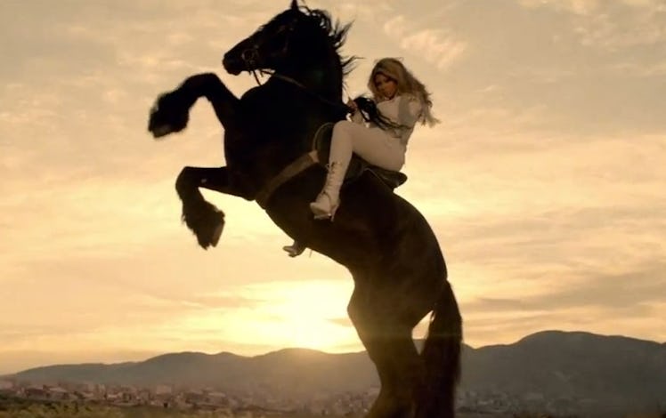 Beyoncé rides a horse in the video for her single “Run The World (Girls).”