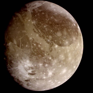Photo of a brownish-white icy moon in space.