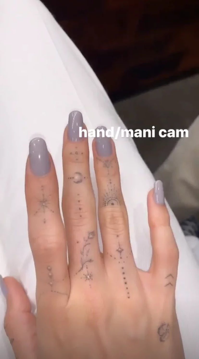 Hailey Bieber's space gray nails.