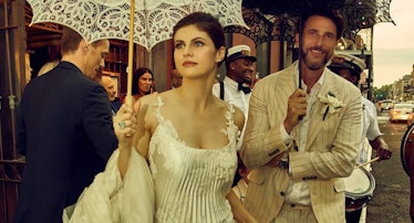 Alexandra Daddario carrying a parasol on her wedding day with Andrew Form