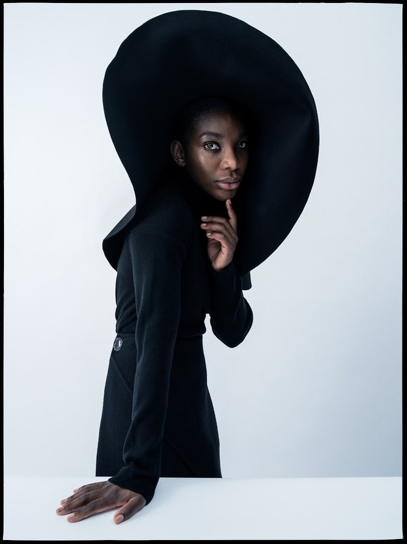 Michaela Coel wearing a large black hat