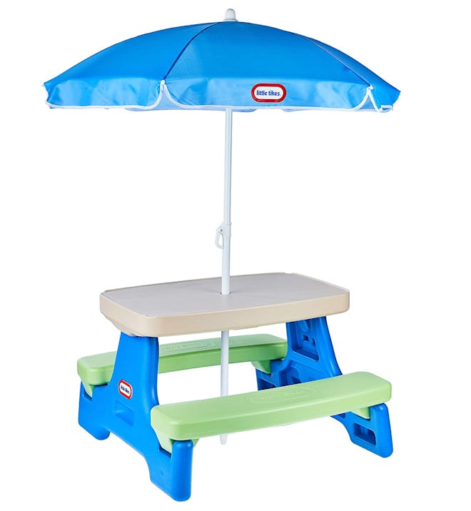 The Little Tikes Easy Store Jr. Picnic Table & Umbrella can turn your backyard into a kid oasis.