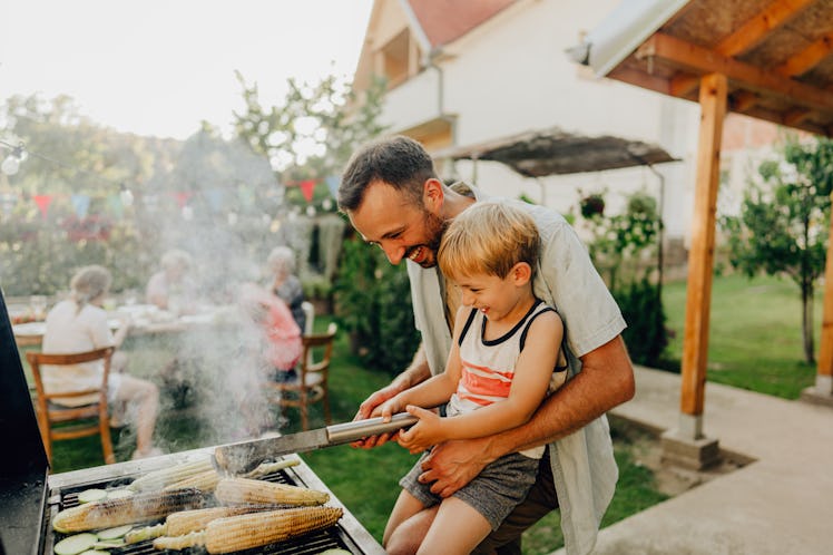 A father and son at a barbecue on Father's day