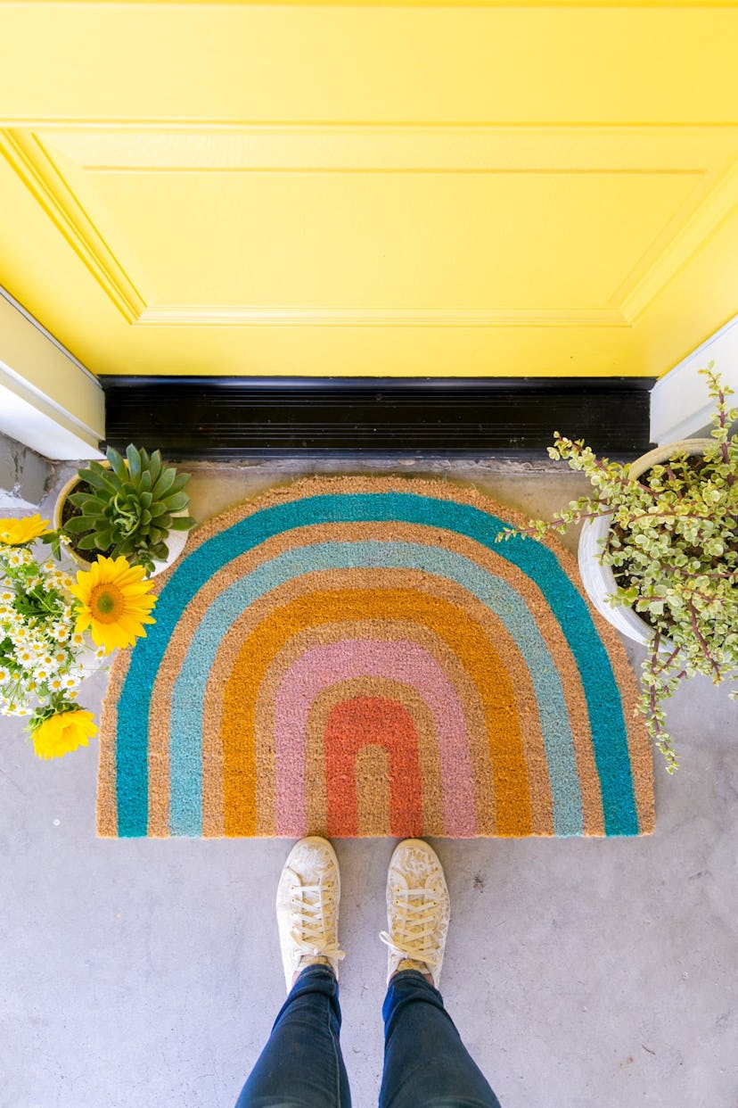 DIY Rainbow doormat from lovely indeed is a cute pride craft idea