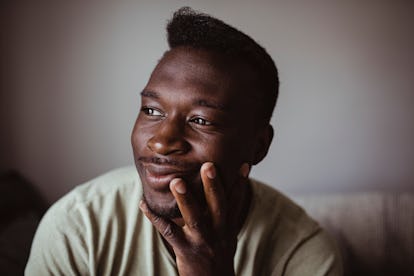 Man stares into space with a satisfied look.