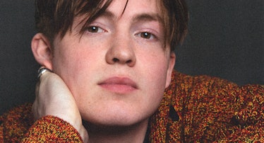 A close-up portrait of Kit Connor