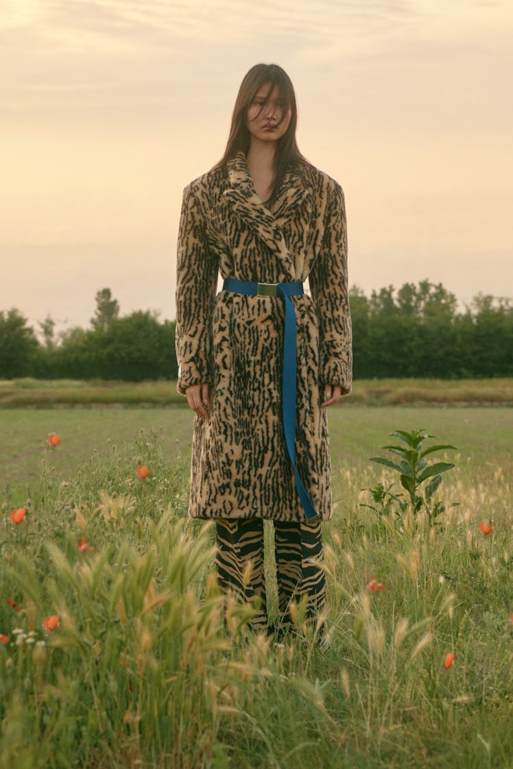 A female model posing in a leopard print Stella McCartney coat