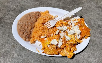 Plate of chilaquiles, rice, and beans.