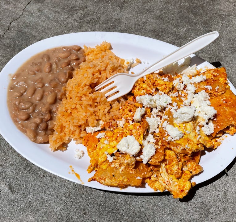 Plate of chilaquiles, rice, and beans.