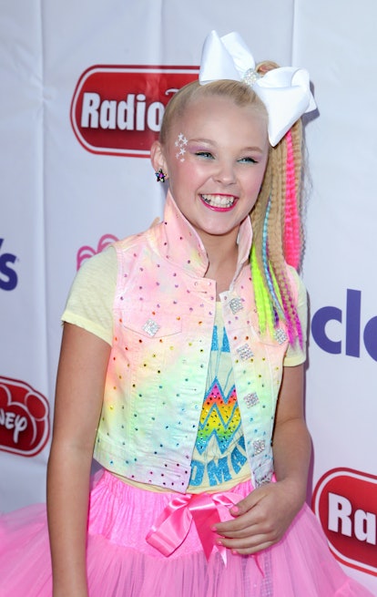 JoJo Siwa wore a crimped ponytail with neon streaks on May 16, 2016 .