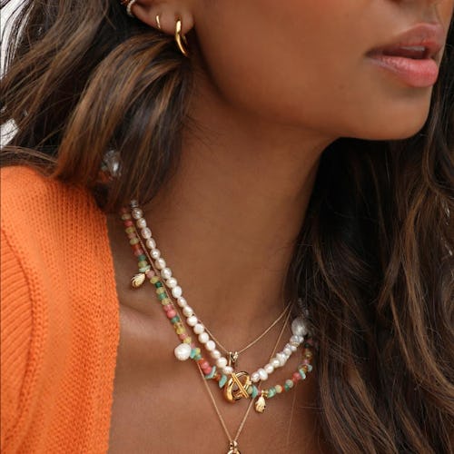 Pearls and colorful pieces are two 2022 jewelry trends