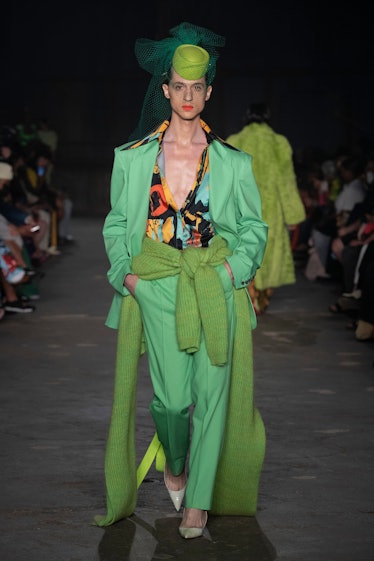 Model in a green blazer and pants at Christopher John Rogers runway show