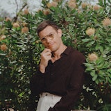 Ryan in front of flowers