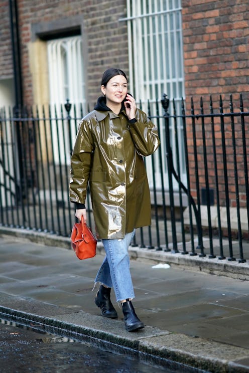 girl in green raincoat street style