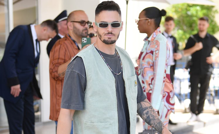 Baptiste Giabiconi wearing a Carhartt vest