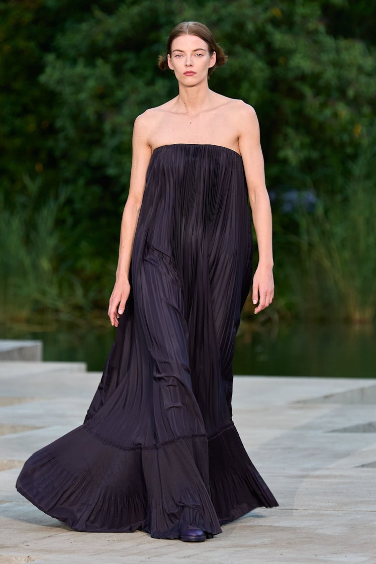A model in a black Max Mara gown