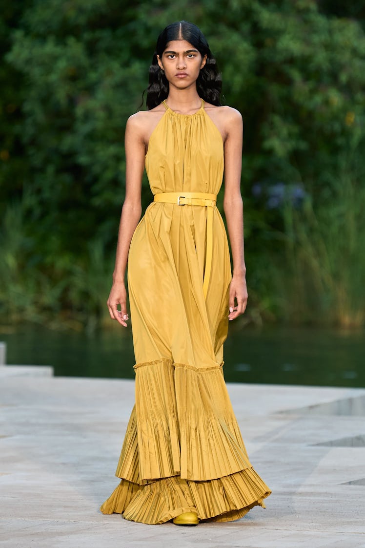 A model in a yellow Max Mara gown