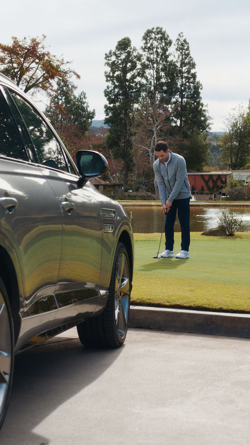 Late-Blooming Golfer practicing on a golf course in front of his Genisis using various tips and poin...